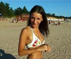 This teen nudist strips bare at a public beach - 5 min